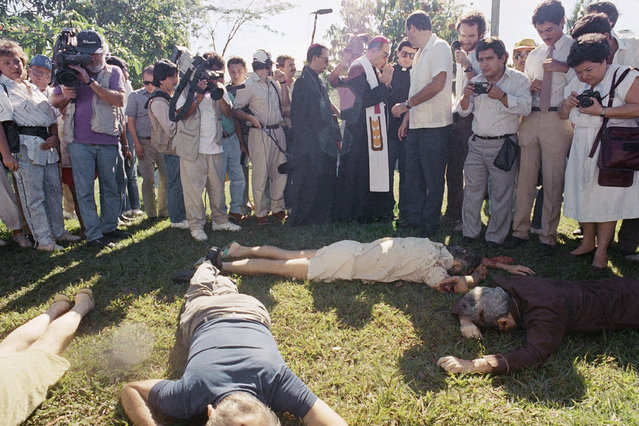 In this November 16, 1989, file photo, the Archbishop of San Salvador, Mons. Arturo Rivera y Damas and journalists view the bodies of six Jesuit priests murdered in San Salvador. The sentencing of former Salvadoran colonel Inocente Orlando Montano to 133 years in prison by a Spanish court on Friday, Sept. 11, 2020, in relation to the 1989 massacre by an elite comando unit is raising calls once again for El Salvador to investigate and prosecute the masterminds of the massacre. (Photo by John Hopper/AP Photo/File)