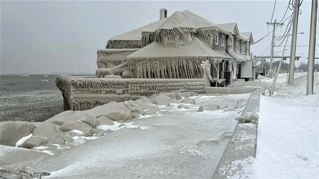 Hoak's restaurant is covered in ice from the spray of Lake Erie waves during a winter storm that hit the Buffalo region in Hamburg, New York, U.S. December 24, 2022.  (Photo by Kevin Hoak via Reuters)