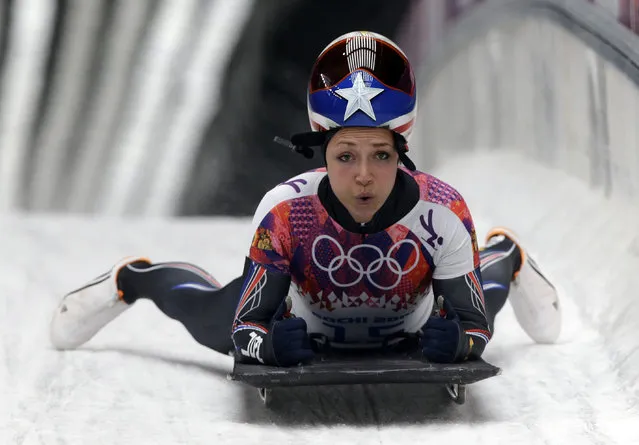 Katie Uhlaender of the United States brakes after her final run during the women's skeleton competition at the 2014 Winter Olympics, Friday, February 14, 2014, in Krasnaya Polyana, Russia. (Photo by Dita Alangkara/AP Photo)