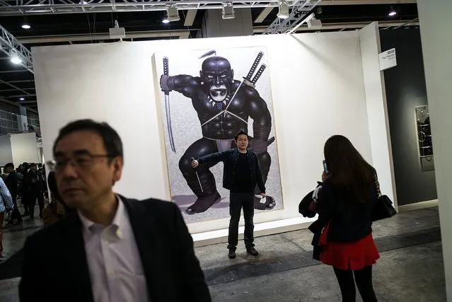 People visit Art Basel on March 24, 2016 in Hong Kong, Hong Kong. (Photo by Lam Yik Fei/Getty Images)