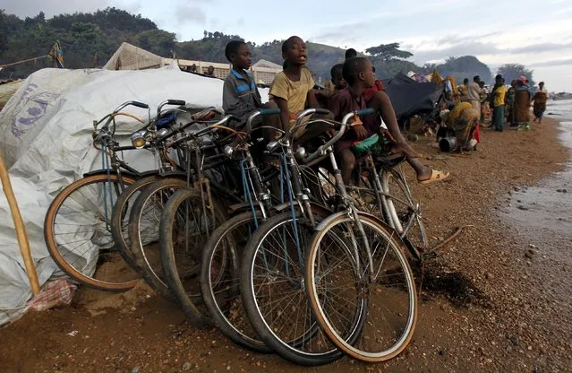 Burundian refugees gather on the shores of Lake Tanganyika in Kagunga village in Kigoma region in western Tanzania with their belongings, as they wait for MV Liemba to transport them to Kigoma township, May 17, 2015. (Photo by Thomas Mukoya/Reuters)