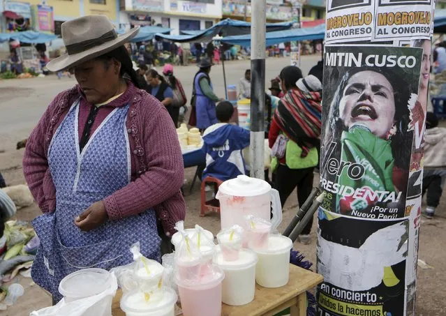 A woman sells yogurt next to a sign of Peru's presidential candidate Veronika Mendoza of the Frente Amplio party in the district of San Jeronimo, ahead of Sunday's presidential election, in Cuzco, Peru April 9, 2016. (Photo by Janine Costa/Reuters)