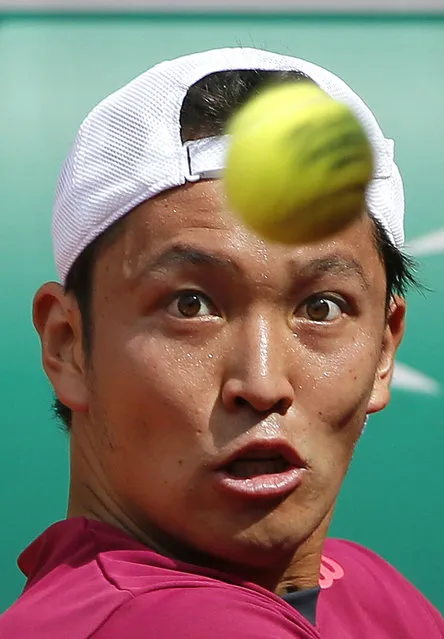 Japan's Tatsuma Ito eyes the ball as he prepares to play a shot to Fabio Fognini of Italy during their men's singles match at the French Open tennis tournament at the Roland Garros stadium in Paris, France, May 25, 2015. (Photo by Gonzalo Fuentes/Reuters)