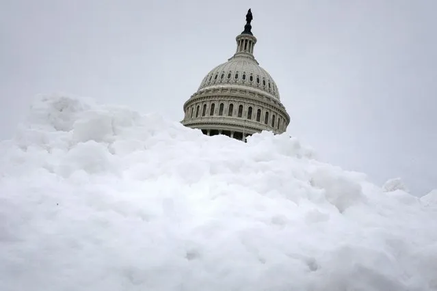 General view of the U.S. Capitol and a snow bank following a storm, on Capitol Hill in Washington, U.S., January 5, 2022. (Photo by Tom Brenner/Reuters)