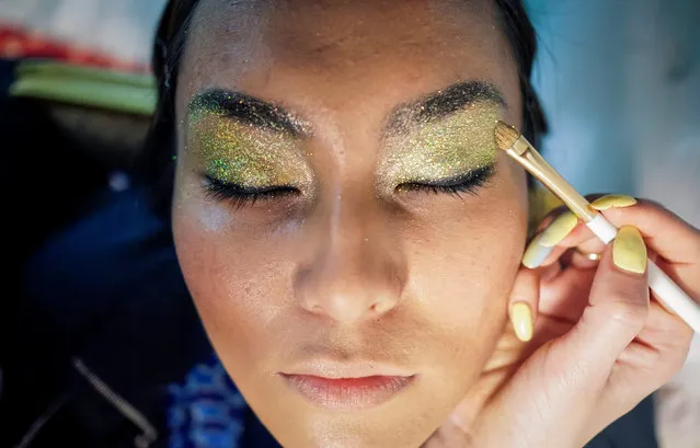 A model has her make up done backstage during Kazakhstan Fashion Week in Almaty, Kazakhstan, April 21, 2016. (Photo by Shamil Zhumatov/Reuters)