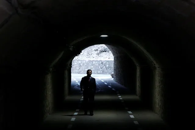 A man walks through a former railway tunnel leading to the historic Qinglongqiao railway station in Badaling, northwest of Beijing, China, March 1, 2017. (Photo by Thomas Peter/Reuters)