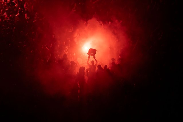 Olympiacos F.C. fans celebrate their team's win of the Conference League Final soccer match between Olympiacos and Fiorentina in Piraeus, Greece, Wednesday, May 29, 2024. Olympiacos won the final by 1-0. (Photo by Michael Varaklas/AP Photo)