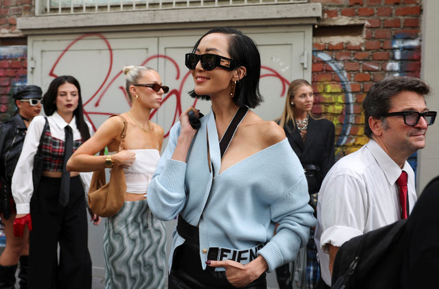 A guest waits outside Fendi fashion show during the Milan Fashion Week Womenswear Spring/Summer 2024, in Milan, Italy on September 20, 2023. (Photo by Claudia Greco/Reuters)