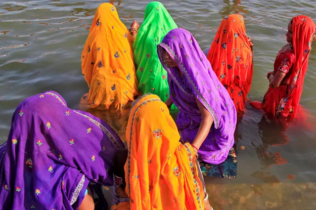Hindu devotees take a holy dip in the Shipra river at the Simhastha Kumbh Mela in Ujjain, India, May 20, 2016. (Photo by Jitendra Prakash/Reuters)