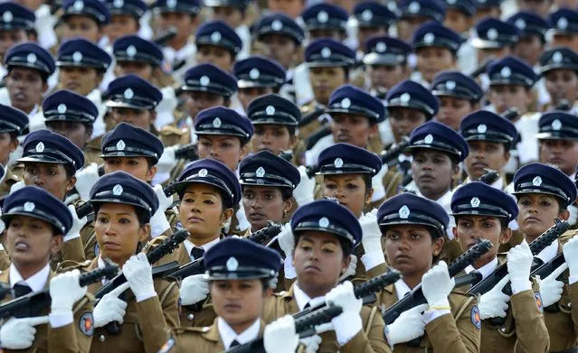 Sri Lankan policewomen march during a Victory Day parade in the southern town of Matara on May 18, 2014. The government is holding a military “victory parade” to mark five years since the defeat of Tamil Tiger rebels, who waged a decades-long battle for a separate homeland for minority Tamils. Services have been banned to honour Tamil rebels and remember civilians killed in the conflict which ended in 2009 after claiming at least 100,000 lives. (Photo by Lakruwan Wanniarachchi/AFP Photo)