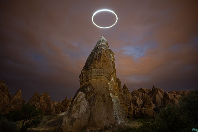 The fairy chimneys are seen with light illuminations created with different techniques in Cappadocia, Nevsehir, Turkiye on August 01, 2024. Fairy chimneys are formed by volcanic eruptions and erosions over millions of years and are considered as one of the unique characteristics of the geography. (Photo by Harun Ozalp/Anadolu via Getty Images)