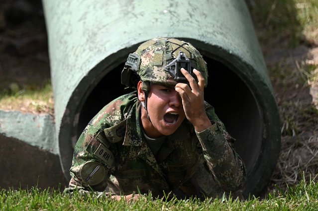 A female soldier takes part in a training for women at the Tolemaida Military Air Base in Tolemaida, Colombia, on May 16, 2023. The last time the Colombian Army enlisted women in their ranks was in 1993. Now, 30 years on, more than 1,200 women voluntarily joined the military service in the country. (Photo by Raul Arboleda/AFP Photo)