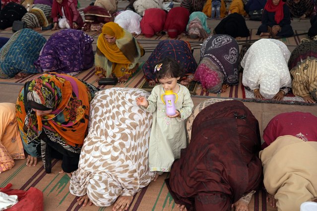 Women offer Eid al-Adha prayers at historical Badshahi mosque in Lahore, Pakistan, Monday, June 17, 2024. (Photo by K.M. Chaudary/AP Photo)