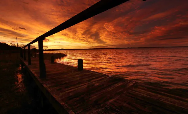 The sun sets over Lake Eustis in Tavares, Fla., following Hurricane Dorian's blow over Florida on September 4, 2019. (Photo by Stephen M. Dowell/Orlando Sentinel/Tribune News Service via Getty Images)