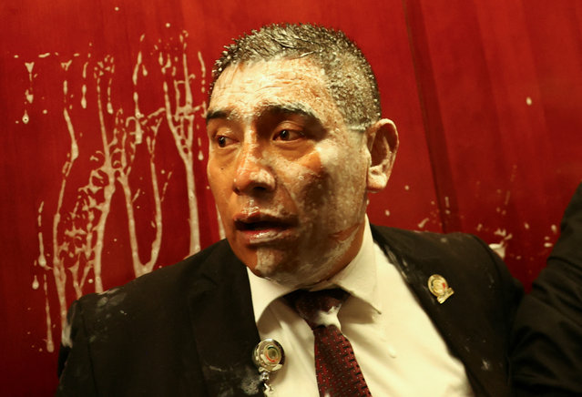 A person reacts as demonstrators enter the Senate building as a highly contested judicial reform proposal is debated, following its approval by the Chamber of Deputies and backing by senators at the commission stage, in Mexico City, Mexico, on September 10, 2024. (Photo by Raquel Cunha/Reuters)