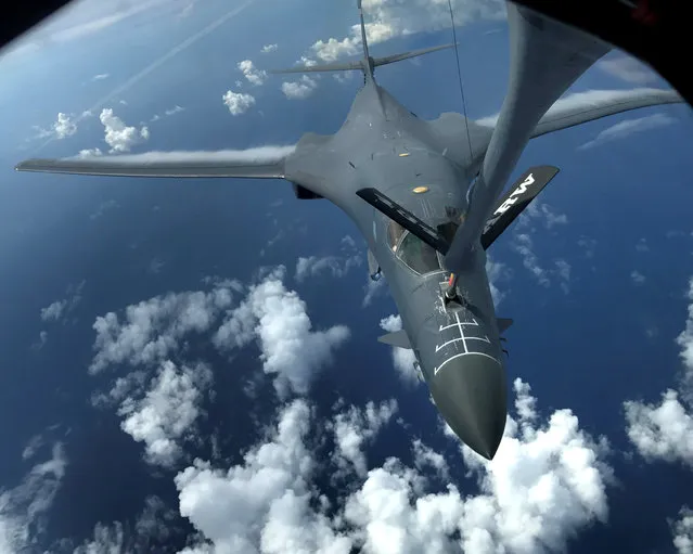 One of two U.S. Air Force B-1B Lancer bombers is refueled during a 10-hour mission flying to the vicinity of Kyushu, Japan, the East China Sea, and the Korean peninsula, over the Pacific Ocean August 8, 2017. (Photo by Airman 1st Class Gerald Willis/Reuters/U.S. Air Force)