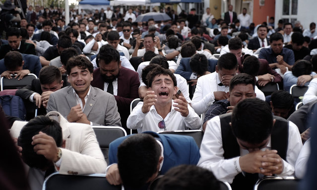 A member of La Luz del Mundo Church reacts in a mass at Hermosa Provincia, the religious group headquarters as part of the “La Santa Convocacion” celebration on August 14, 2023 in Guadalajara, Mexico. The full week celebration received thousands of members of the church from many states of the country and abroad after 3 years of taking place virtually due to the Covid-19 pandemic. Its leader Naason Joaquin Garcia was sentenced to over 16 years and 8 months in prison for sexual abuse. (Photo by Leonardo Alvarez Hernandez/Getty Images)