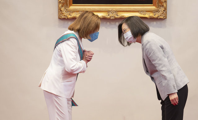 In this photo released by the Taiwan Presidential Office, U.S. House Speaker Nancy Pelosi, left, and Taiwanese President President Tsai Ing-wen gesture during a meeting in Taipei, Taiwan, Wednesday, August 3, 2022. U.S. House Speaker Nancy Pelosi, meeting top officials in Taiwan despite warnings from China, said Wednesday that she and other congressional leaders in a visiting delegation are showing they will not abandon their commitment to the self-governing island. (Photo by Taiwan Presidential Office via AP Photo)