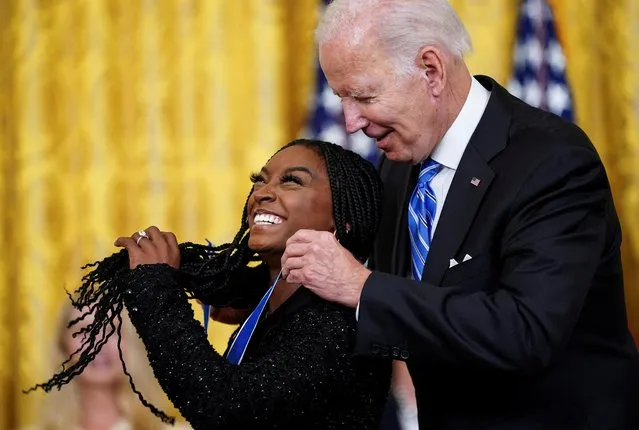 U.S. President Joe Biden awards the Presidential Medal of Freedom to U.S. Olympic gymnast Simone Biles during a ceremony in the East Room at the White House in Washington, U.S., July 7, 2022. (Photo by Kevin Lamarque/Reuters)