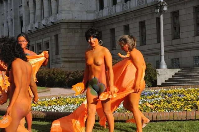 Women with body paintings take part in a demo in favour of the legalization of abortion in front of the Congress building in Montevideo on September 25, 2012. The Congress is voting a law project which would decriminilize the interruption of pregnancy under certain conditions, including obliging women to set out before a tribunal the reasons for the abortion.  AFP PHOTO/Miguel ROJO        (Photo credit should read MIGUEL ROJO/AFP/GettyImages)