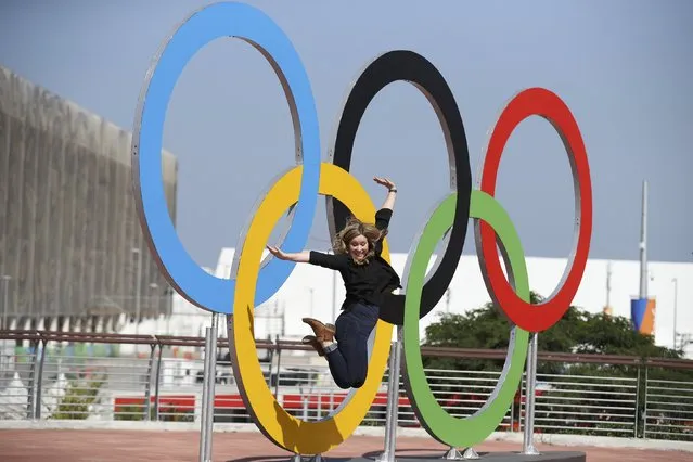 Rio Olympics, Olympic Park, Rio de Janeiro, Brazil on August 5, 2016. Woman jumps in front of Olympic rings. (Photo by Phil Noble/Reuters)