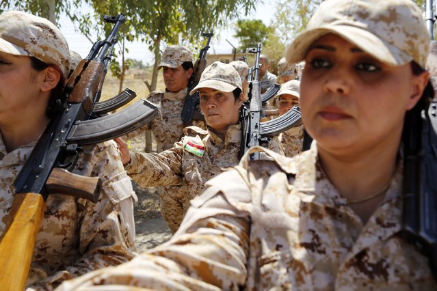 Kurdish Peshmerga female fighters march during combat skills training before being deployed to fight the Islamic State at their military camp in Sulaimaniya, northern Iraq September 18, 2014. (Photo by Ahmed Jadallah/Reuters)