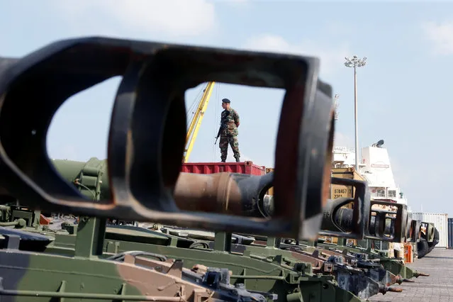 A Lebanese Army soldier stands near unloaded Howitzers, part of a military donation from the U.S. government to the Lebanese army, during a ceremony at Beirut's port, Lebanon, August 9, 2016. (Photo by Mohamed Azakir/Reuters)