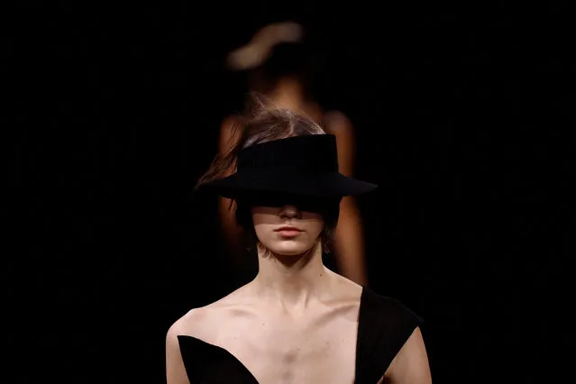 Models present creations by designer Yohji Yamamoto as part of his Spring-Summer 2023 Women's ready-to-wear collection show during Paris Fashion Week, France on September 30, 2022. (Photo by Christian Hartmann/Reuters)