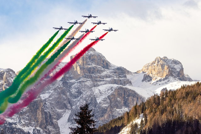 Italian Frecce Tricolori aerobatic team performs before the first run of the Men's Giant Slalom race at the FIS Alpine Skiing World Cup event in Alta Badia, Italy, 22 December 2024. (Photo by Andrea Solero/EPA)