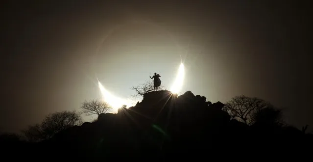 “Hybrid Solar Eclipse 2”. A Kenyan landscape serves as the foreground for a solar eclipse. Winner in the People and Space category. (Photo by Eugen Kamenew, Germany/The Astronomy Photographer of the Year 2014 Contest)