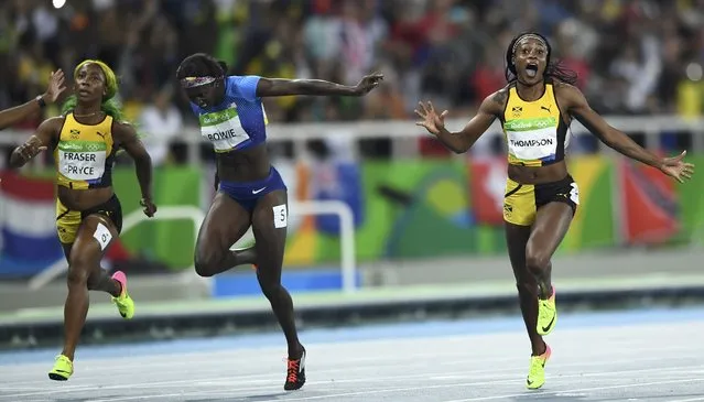 2016 Rio Olympics, Athletics, Final, Women's 100m Final, Olympic Stadium, Rio de Janeiro, Brazil on August 13, 2016. Elaine Thompson (JAM) of Jamaica celebrates as she wins the race ahead of Tori Bowie (USA) of USA and Shelly-Ann Fraser-Pryce (JAM) of Jamaica. (Photo by Dylan Martinez/Reuters)