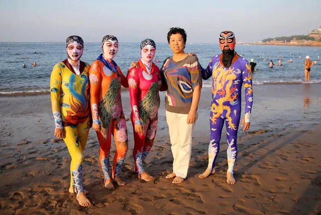 Zhang Shifan and her sixth-generation facekinis in Shandong Province, Qingdao, East China. A woman credited with inventing the bizarre swimwear known as the “facekini” has now proudly presented the sixth generation of the iconic beach clothing. The new facekini models are not only more comfortable, they also come in a wider variety of colours and patterns, bringing both style and practicality to beach-goers in Qingdao City, in East China's Shandong Province, who fear tan lines. While first-generation facekinis designed by 60-year-old Zhang Shifan were – as the name suggests – only headwear, later versions transformed the concept into a full-body swimsuit. (Photo by CEN)