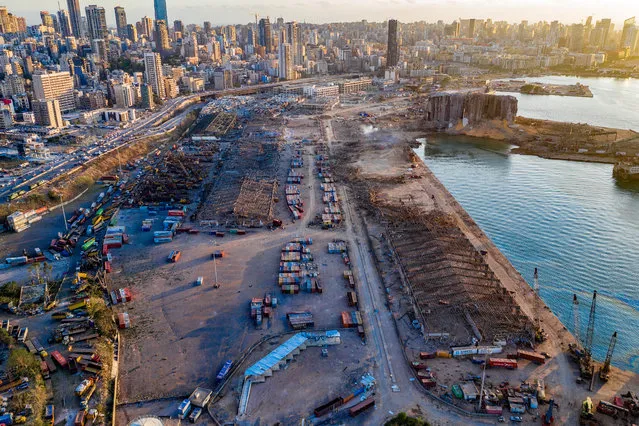 An aerial view of ruined structures at the port, damaged by an explosion a day earlier, on August 5, 2020 in Beirut, Lebanon. As of Wednesday, more than 100 people were confirmed dead, with thousands injured, when an explosion rocked the Lebanese capital. Officials said a waterfront warehouse storing explosive materials, reportedly 2,700 tons of ammonium nitrate, was the cause of the blast. (Photo by Haytham Al Achkar/Getty Images)