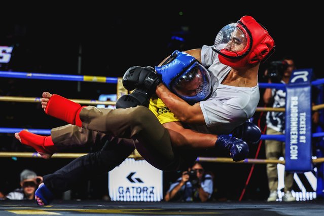 Police officers take part in “Cops Combat”, Thailand's martial art competition for police nationwide, which is held to encourage police officers to improve self-defence skills at Rajadamnern Stadium in Bangkok, Thailand, on May 6, 2025. (Photo by Chalinee Thirasupa/Reuters)