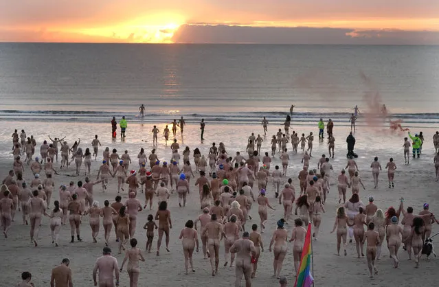 People take part in the North East Skinny Dip on Sunday, September 25, 2022 at Druridge Bay in Northumberland, UK as the annual event is celebrating its tenth anniversary as it marks the Autumn Equinox and raises money for MIND – the Mental Health Charity. (Photo by Owen Humphreys/PA Images via Getty Images)