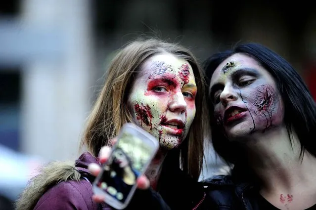 People dressed as a zombie taking part in Zombie Parade on a streets of Belgrade during a zombie walk in Belgrade, on October 26, 2014. (Photo by Oksana Toskic/SIPA Press)
