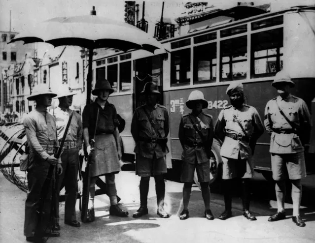 Just before the British left China, these gentlemen met up for a photo session, 25th September 1940. There is an American Marine, a British “Tommy”, a Chinese Policeman, a Japanese Policeman, an Indian Policeman and a regular British Policeman. They were all resident in the world's most international city, Shanghai. (Photo by Keystone/Getty Images)