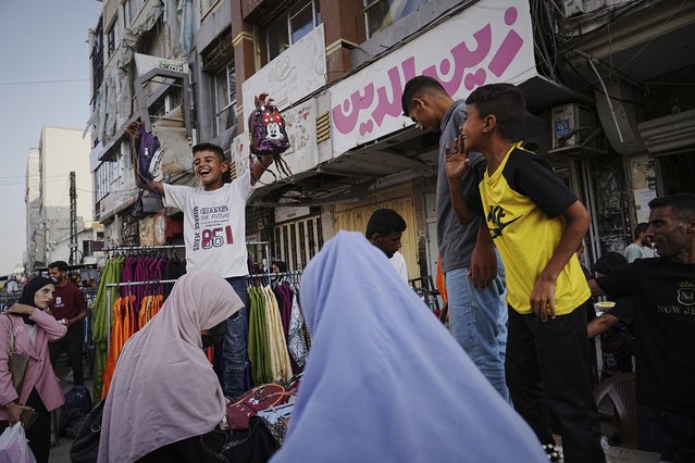 Palestinians walk trough a market ahead of the Muslim holiday of Eid al-Adha, in Gaza City on Thursday, June 5, 2025. (Photo by Jehad Alshrafi/AP Photo)