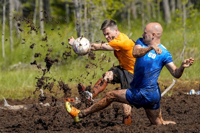 Players in action during the Swamp Soccer Championships 2025 in Hyrynsalmi, Finland, 11 July 2025. The World Championship in swamp football is played annually on Vuorisuo bog in Hyrynsalmi. (Photo by Tomi Hanninen/EPA)