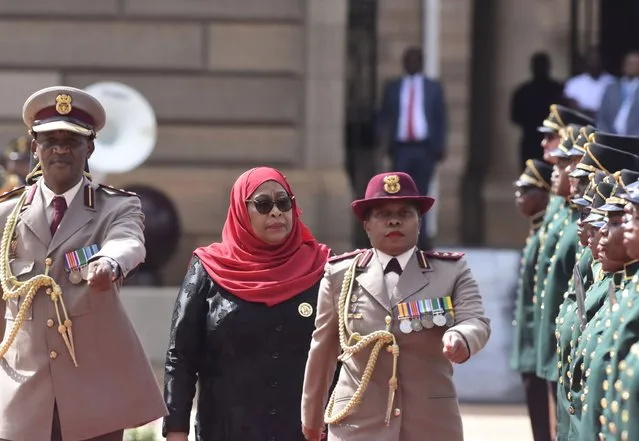 Tanzanian President Samia Suluhu Hassan inspects a guard of honour at a welcoming ceremony in Pretoria, South Africa, Thursday, March 16, 2023. Hassan, on a state visit to the country, has urged more security cooperation and trade between the two countries. (Photo by Frans Sello waga Machate/AP Photo)