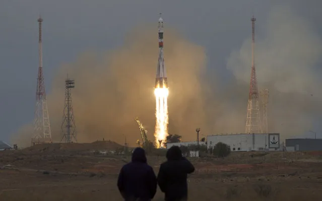 The Soyuz rocket booster with Soyuz MS-2 space ship carrying a new crew to the International Space Station, ISS, blasts off in Russian leased Baikonur cosmodrome, Kazakhstan, on Wednesday, October 19, 2016. The Russian rocket carries US astronaut Shane Kimbrough, Russian cosmonauts Sergey Ryzhikov and Andrey Borisenko. (Photo by Ivan Sekretarev/AP Photo)