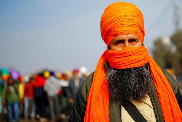 A framer attends a protest against the newly passed farm bills at Singhu border near New Delhi, India, December 14, 2020. (Photo by Adnan Abidi/Reuters)