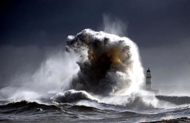 “Raging sea's Seaham 2”. A raging sea Dwarfs Seaham Lighthouse in County Durham in England, with 100ft waves after a cold front moved down from the north bringing freezing temperatures to the North of England. (Photo and caption by Owen Humphreys/National Geographic Traveler Photo Contest)