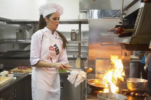 Miss Peru 2014 Jimena Vecco prepares a dish for a cook-off at the Chaplin School of Hospitality and Tourism during the 63rd annual Miss Universe Pageant in Miami, Florida in this January 13, 2015 handout photo provided by Miss Universe Organization. (Photo by Reuters/Miss Universe Organization)