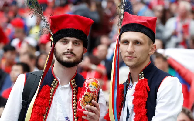 Russia fans pose before the Russia 2018 World Cup Group A football match between Russia and Saudi Arabia at the Luzhniki Stadium in Moscow on June 14, 2018. (Photo by Christian Hartmann/Reuters)