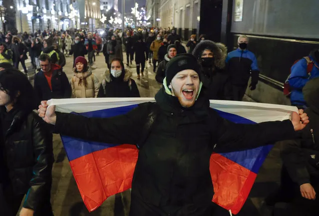 People attend a protest after Russian opposition leader Alexei Navalny was sentenced to jail in Moscow, Russia, Tuesday, February 2, 2021. (Photo by Pavel Golovkin/AP Photo)