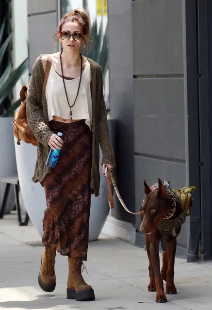 American model Paris Jackson gives the peace sign while walking her Doberman Pincher in West Hollywood on Sunday, June 4, 2023. Paris just recently got back to L.A. after performing at BottleRock music festival last weekend in Napa as she gets ready for her upcoming summer tour with the band Incubus. Paris was in West Hollywood having lunch with a friend. (Photo by GARRETT/The Mega Agency)