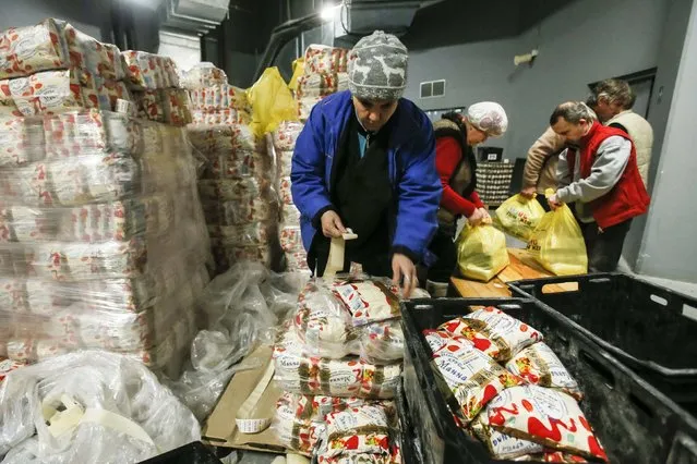 Workers from Rinat Akhmetov's Foundation sort humanitarian aid at Donbass Arena stadium in Donetsk February 3, 2015. (Photo by Maxim Shemetov/Reuters)