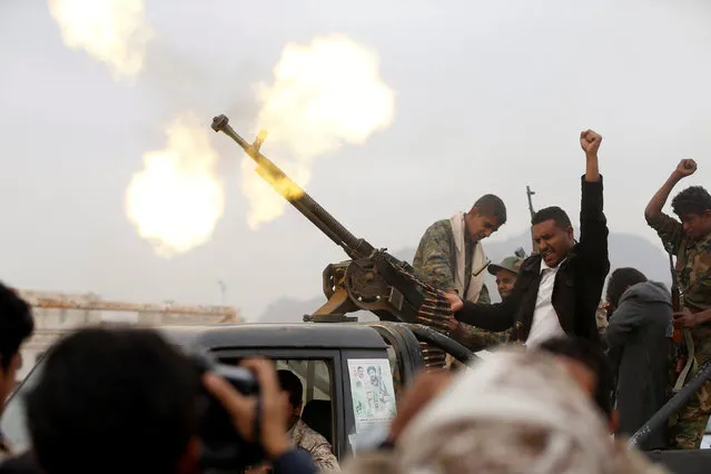 Houthi militants fire a weapon during a tribal gathering held to show support to the Houthi movement in Sanaa, Yemen November 10, 2016. (Photo by Khaled Abdullah/Reuters)