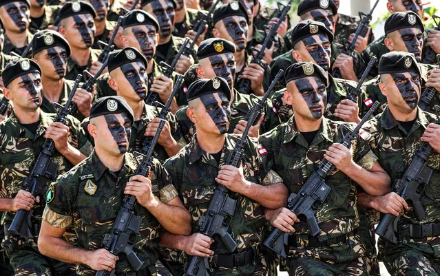 Lebanese Army commandos march in a military parade during an official ceremony commemorating the country's 73rd independence day in the capital Beirut, on November 22, 2016. (Photo by Anwar Amro/AFP Photo)